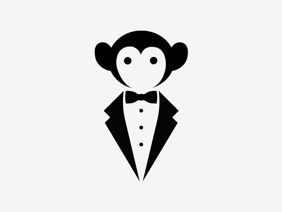 Stylish monkey in a tuxedo, embodying playful sophistication for kids' fashion at events.