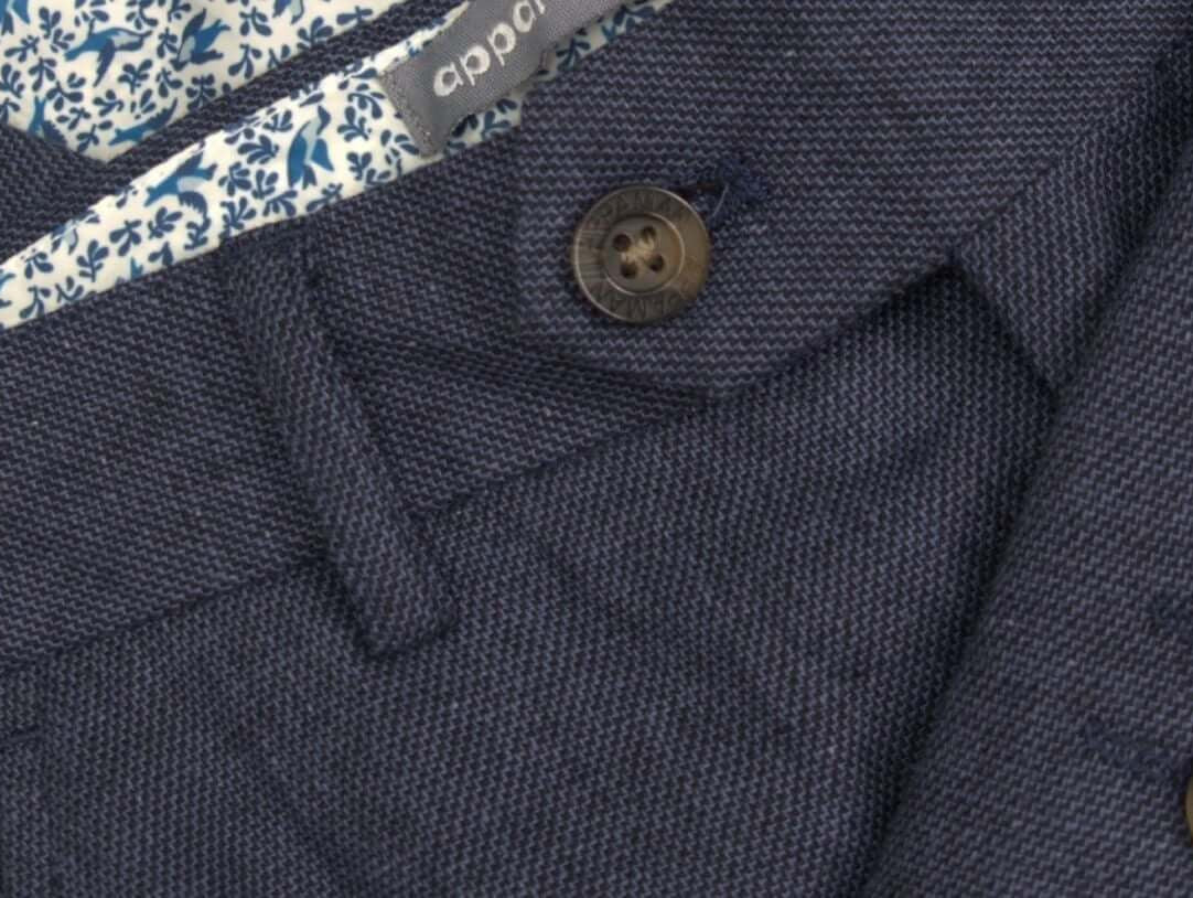 Stylish navy linen suit with playful patterned lining, perfect for kids’ spring celebrations and elegant outings.