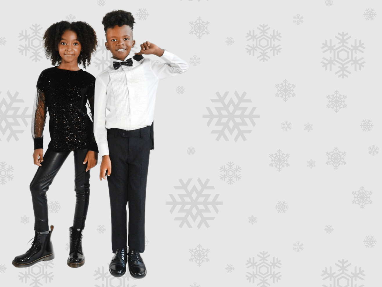 Stylish kids dressed for the holidays: a girl in sequins and a boy in a tuxedo, ready to celebrate in style.