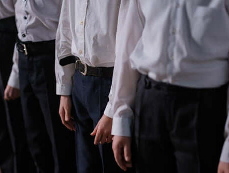 Boys in stylish dress shirts and tailored pants, showcasing modern kids fashion for formal occasions.