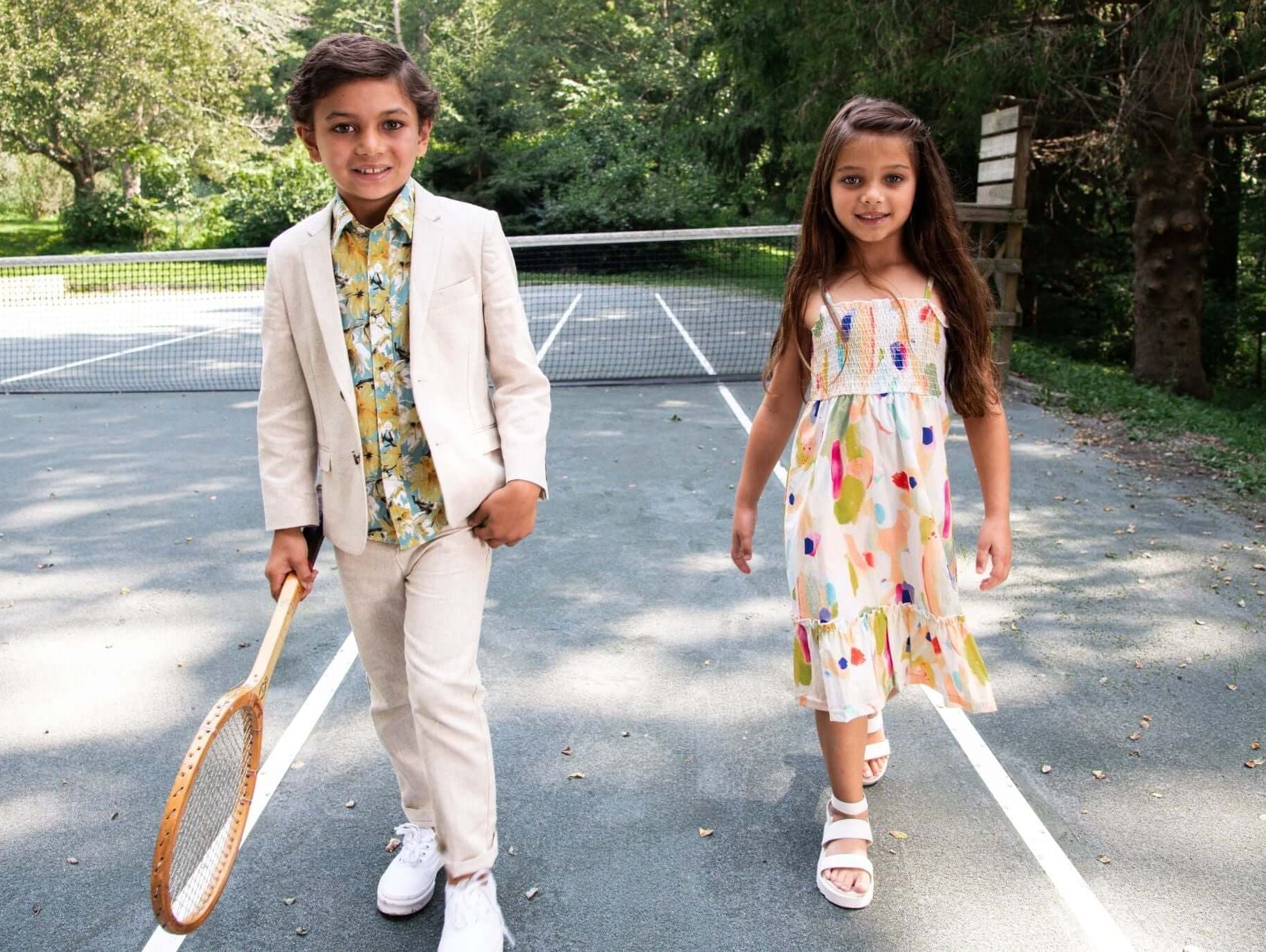 Stylish kids rocking playful outfits for a trendy day at the court, perfect for summer adventures.