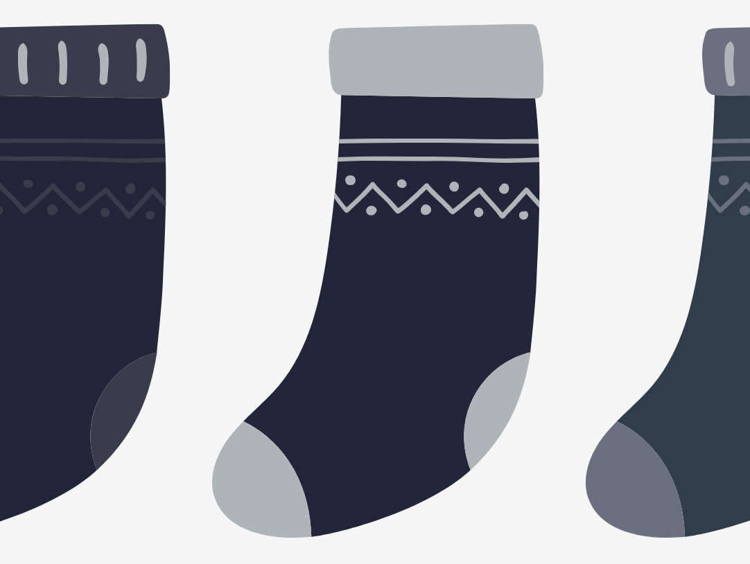 Stylish illustrated socks in navy with fun patterns, perfect for festive stockings this holiday season.