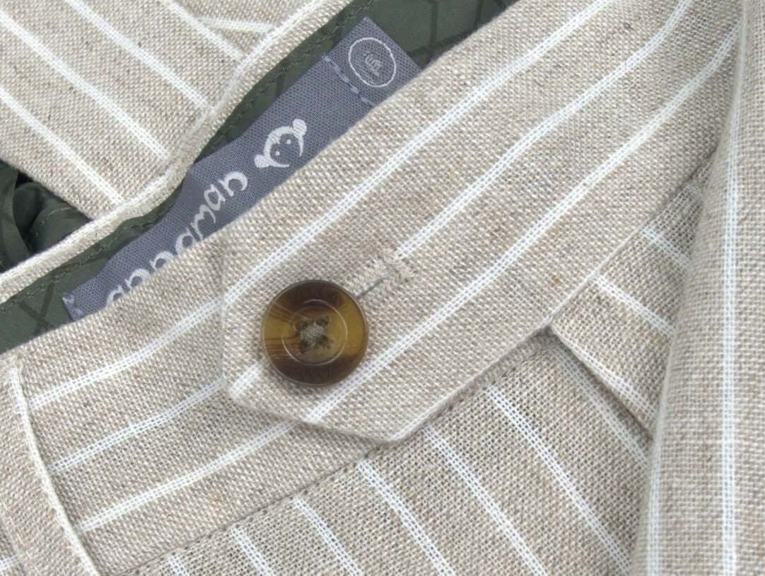 Stylish striped linen suit detail with buttons and lining, perfect for kids' wedding fashion.