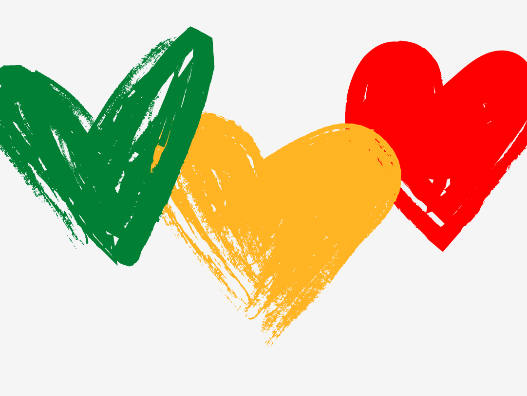 Colorful hearts in green, yellow, and red celebrating diversity and unity for Juneteenth.