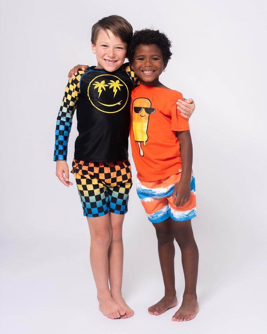Boys' Swimsuits: Two boys smiling in colorful swimwear ready for summer fun