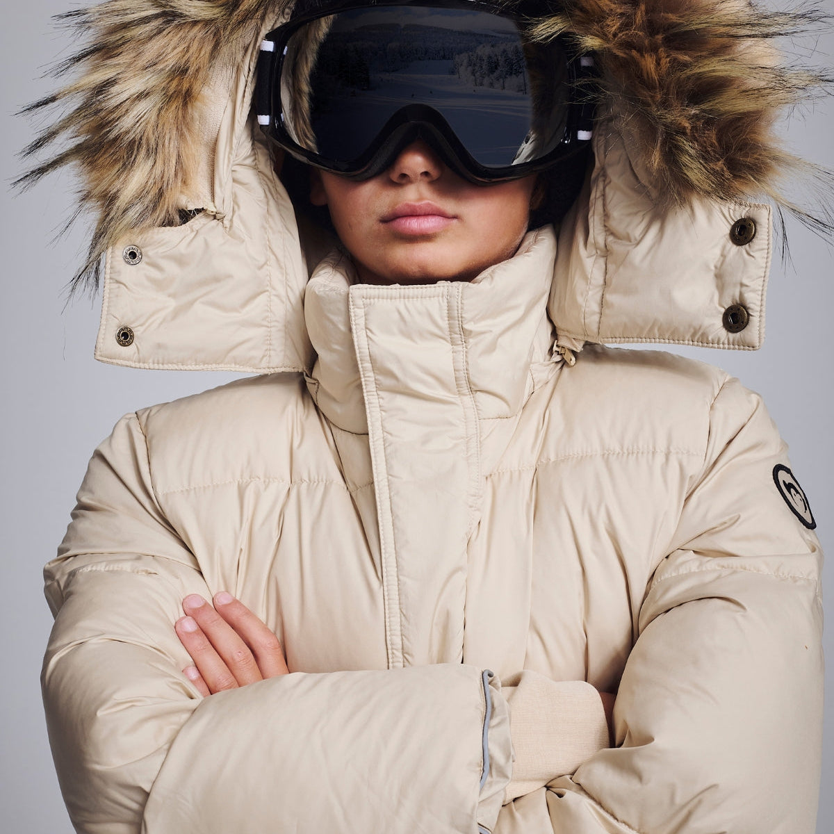 Stylish kids in cozy winter coats—one navy puffer, one chic black jacket, perfect for fun winter adventures!