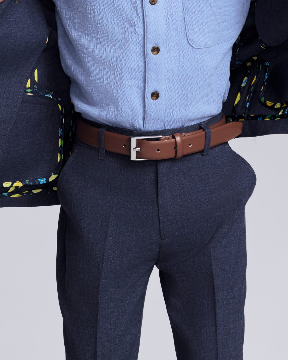 Boys' Belts featuring a stylish black belt worn with a dress shirt and trousers.