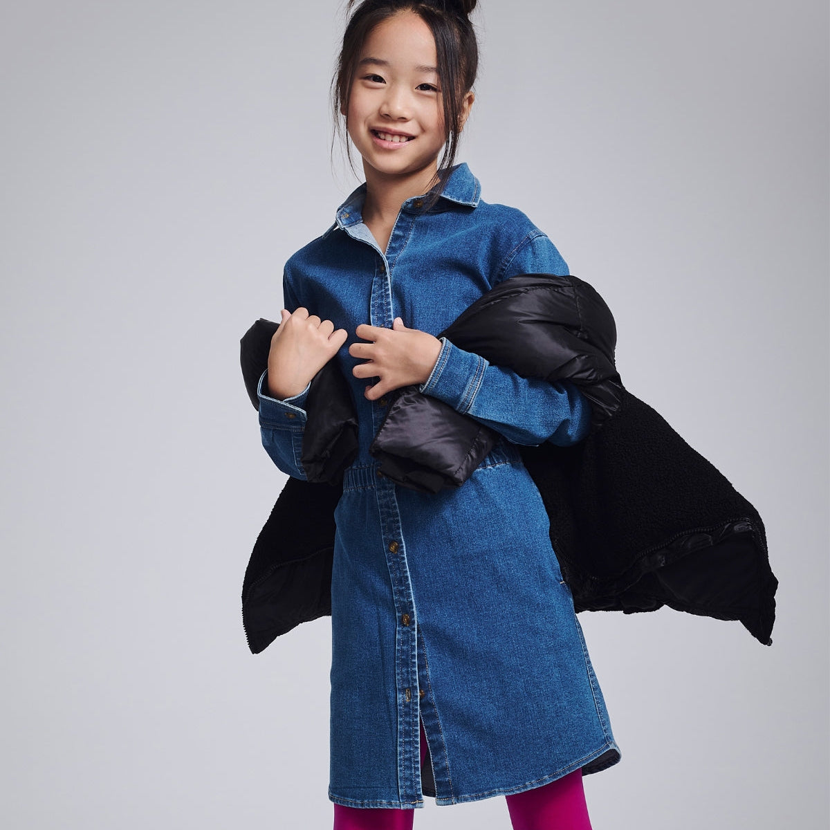 Cheerful girl in a vibrant yellow floral dress, perfect for sunny days and back-to-school adventures!