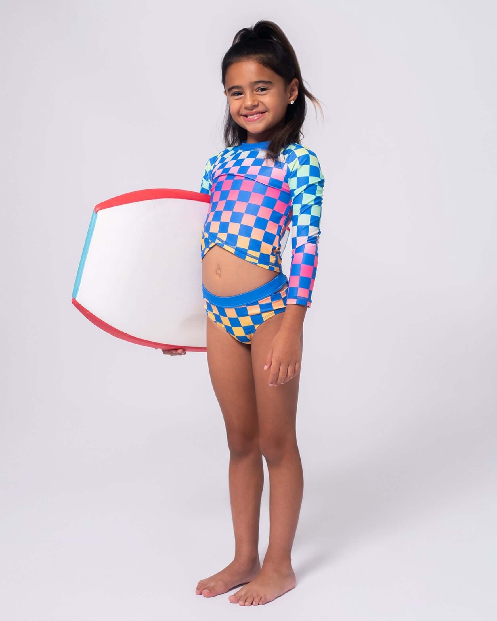 Girls' Rash Guards & Swim Shirts: Colorful swim shirt and bikini with a boogie board.