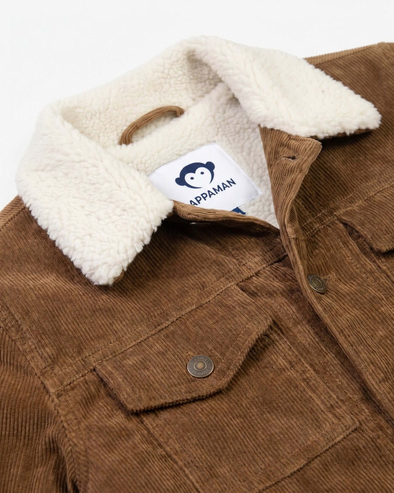 Brown jacket with white sherpa lining and Appaman label