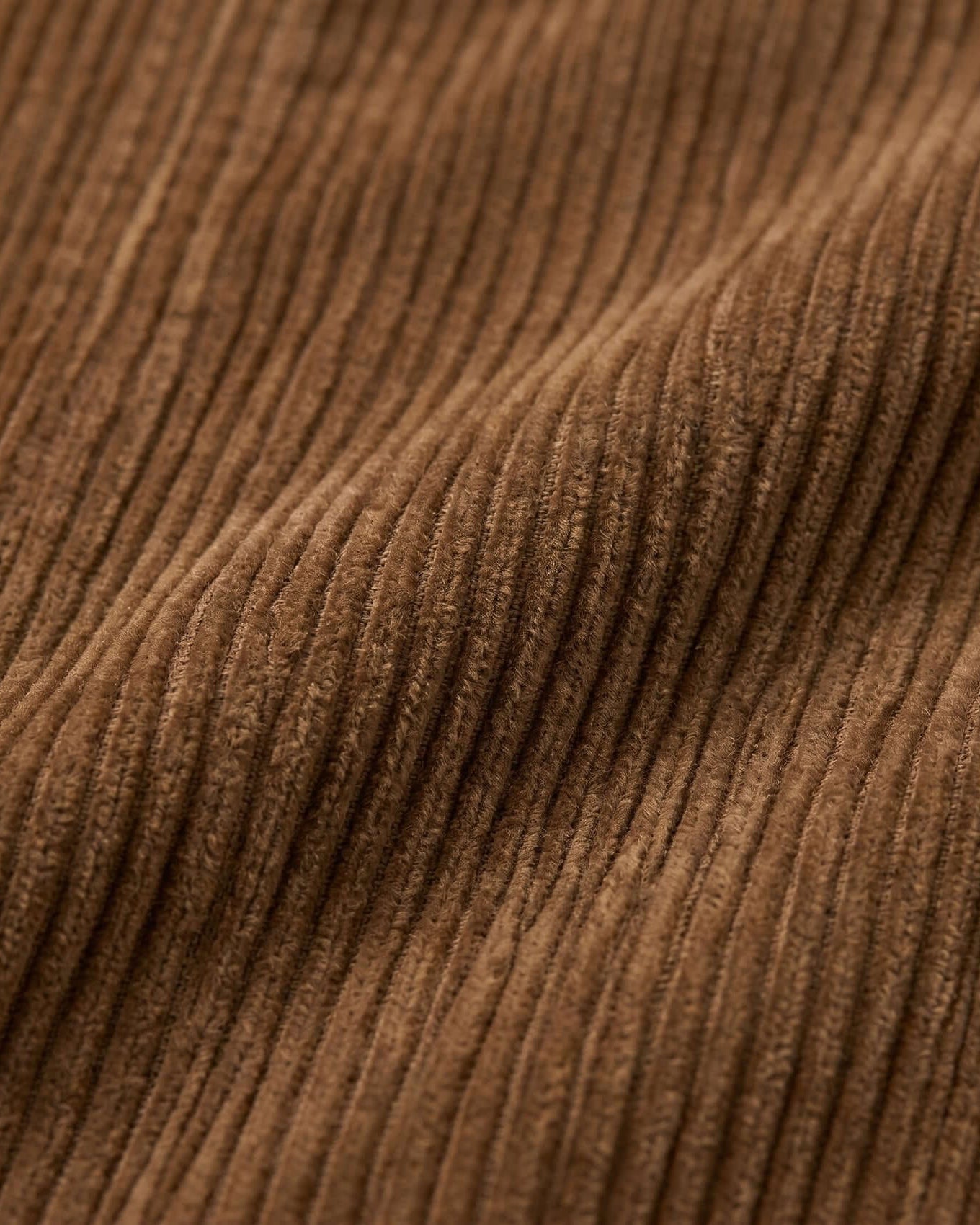 Close-up of brown corduroy fabric texture