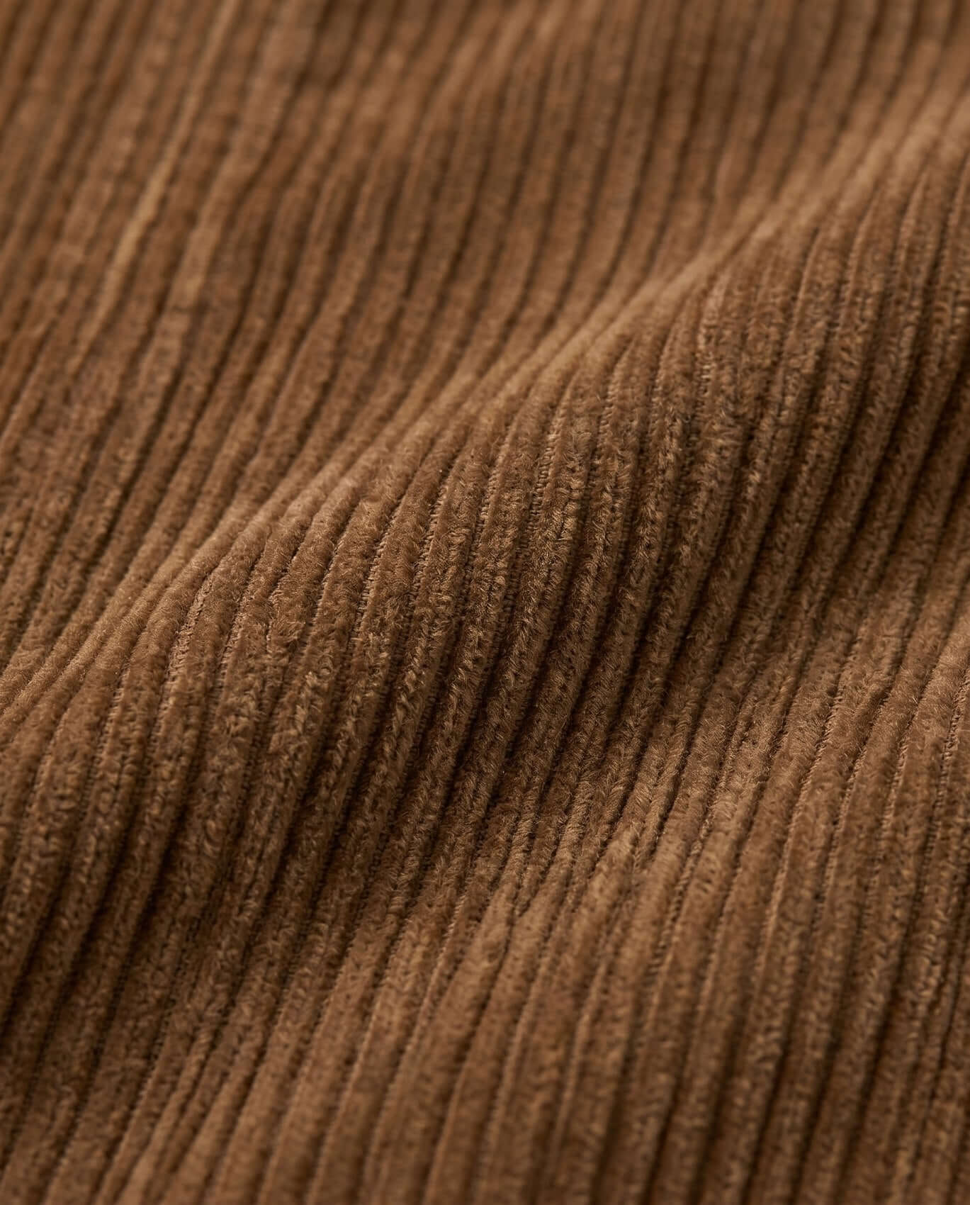 Close-up of brown corduroy fabric texture
