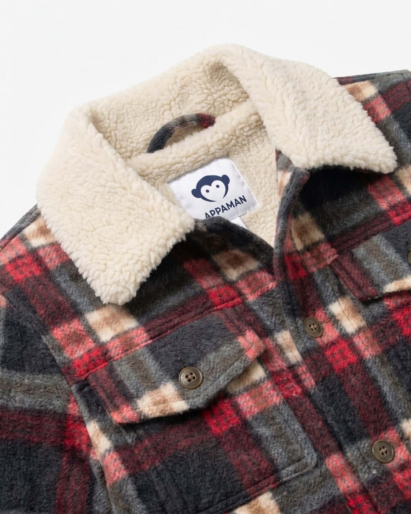 Plaid jacket with sherpa lining and a brand label on a white background