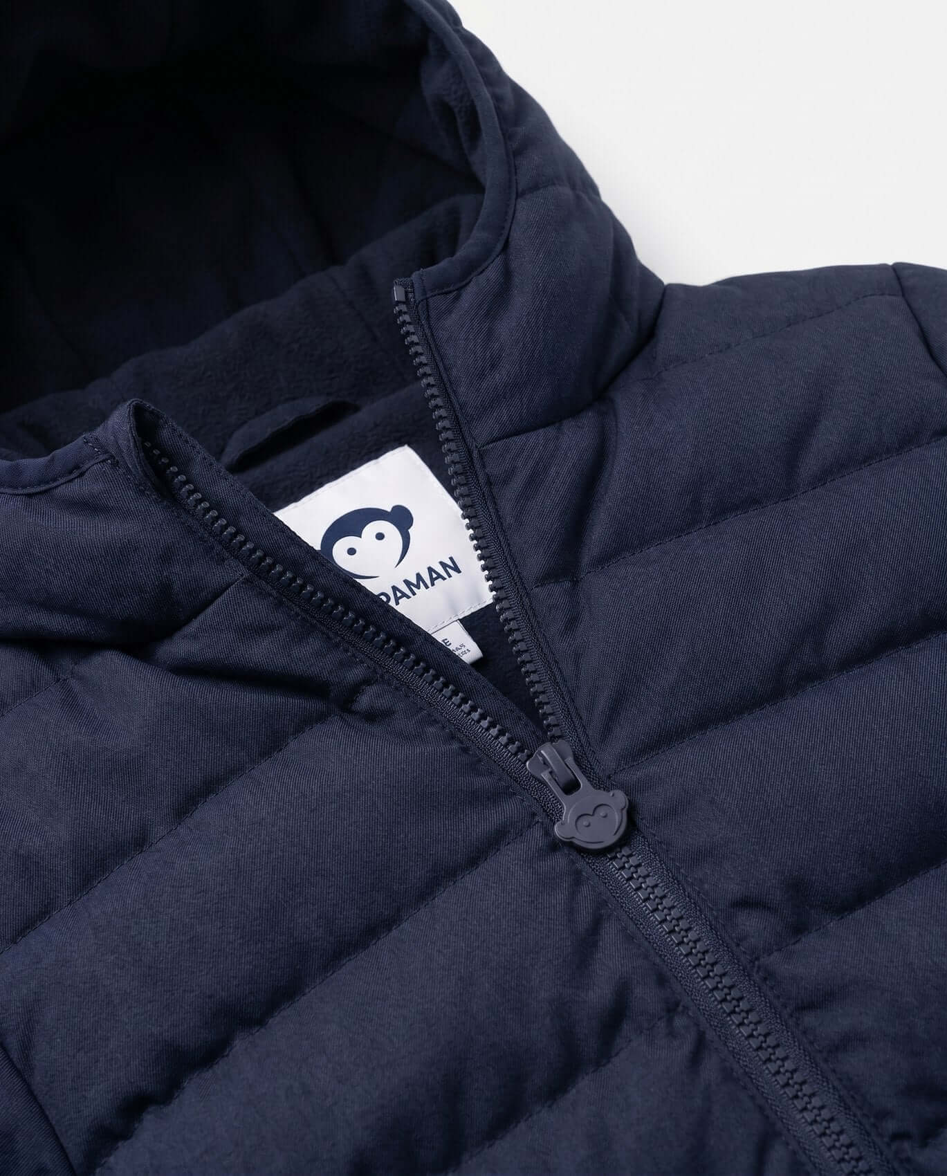 Navy blue puffer jacket with a brand logo on the zipper area against a white background