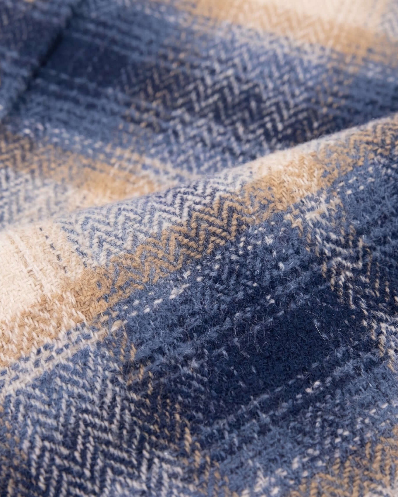 Close-up of blue and beige checkered fabric texture
