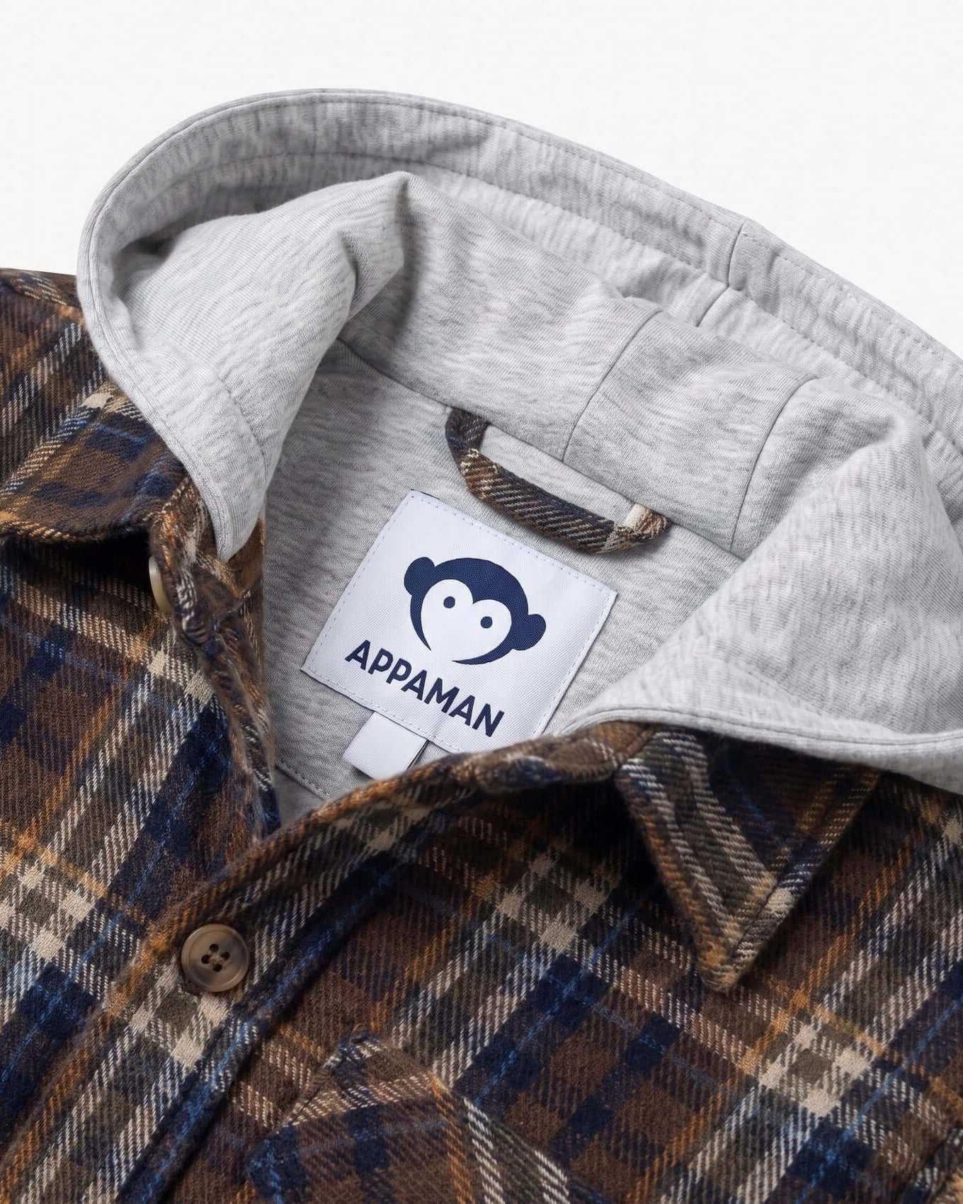 Close-up of a plaid shirt with a gray collar and Appaman brand tag.