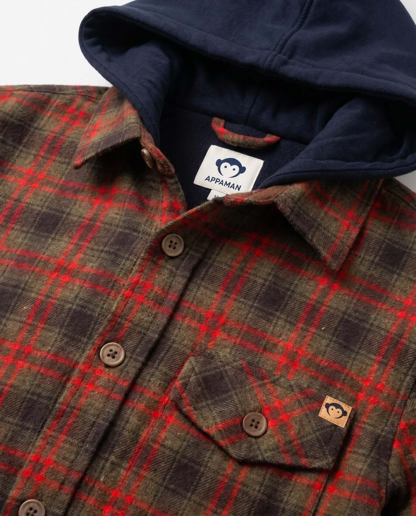 Plaid shirt with navy hoodie on a white background, featuring Appaman logo.