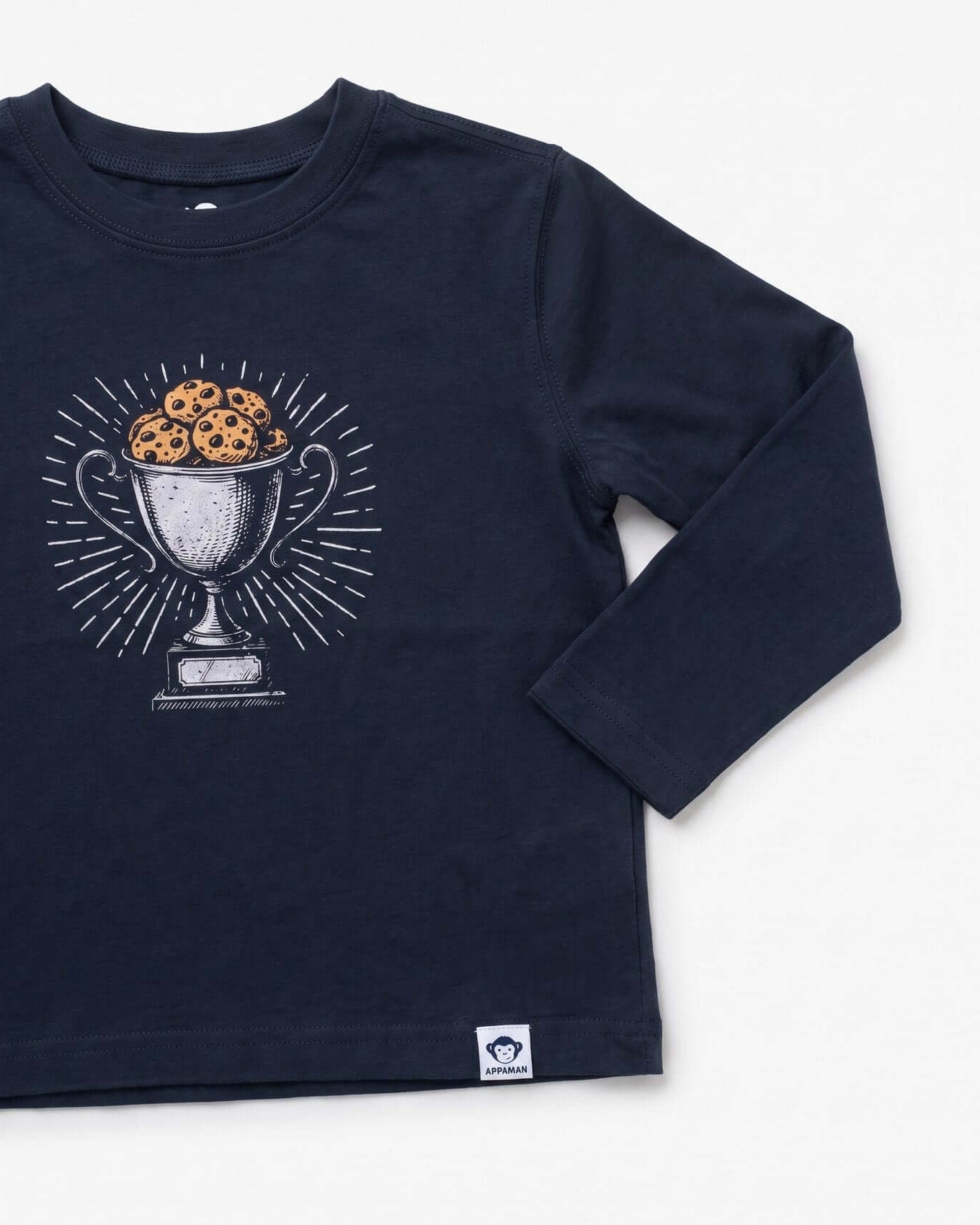 Navy blue long-sleeve shirt with a graphic of a trophy filled with cookies on a white background