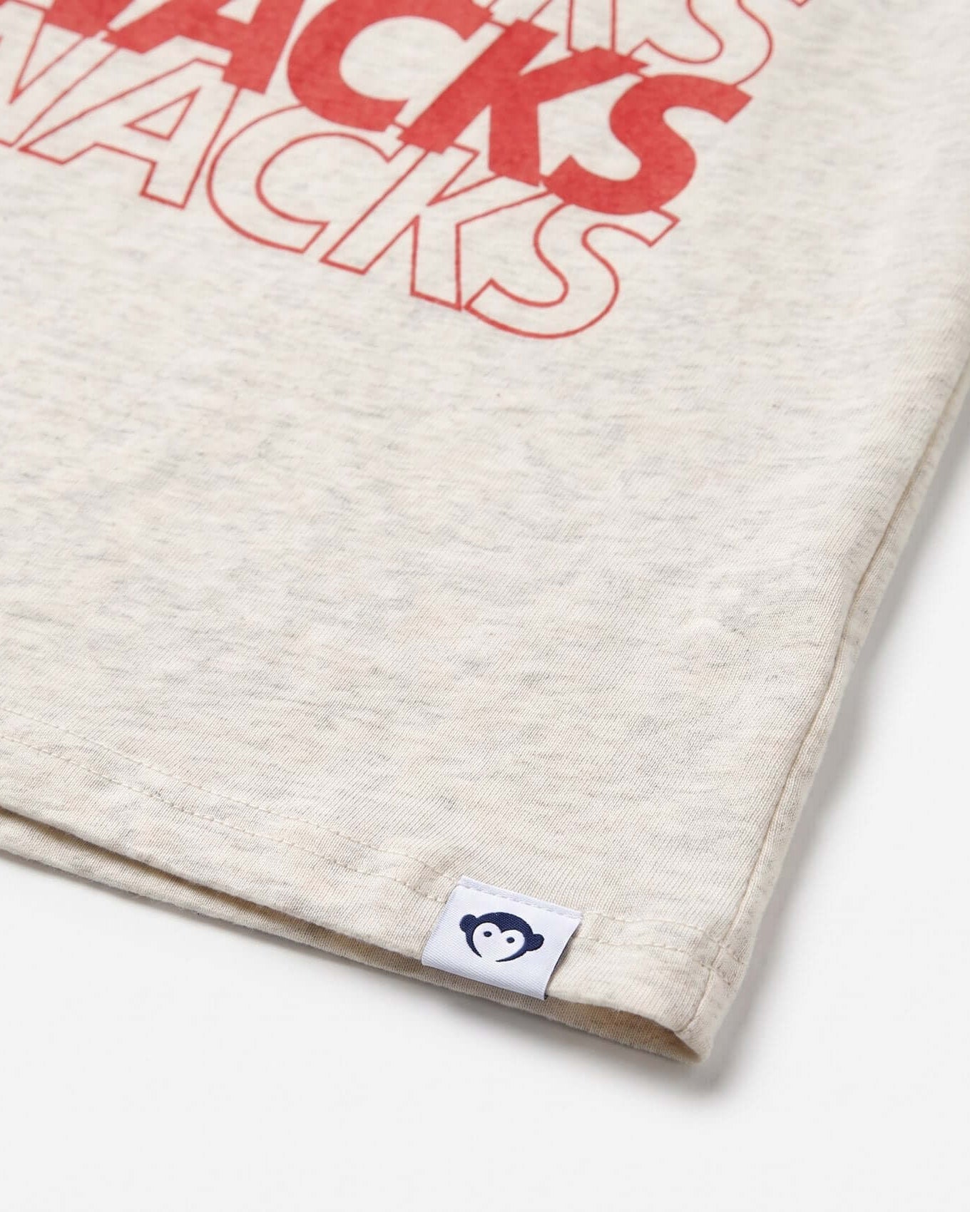 Beige fabric with red text 'SNACKS SNACKS' and a brand logo on a white background
