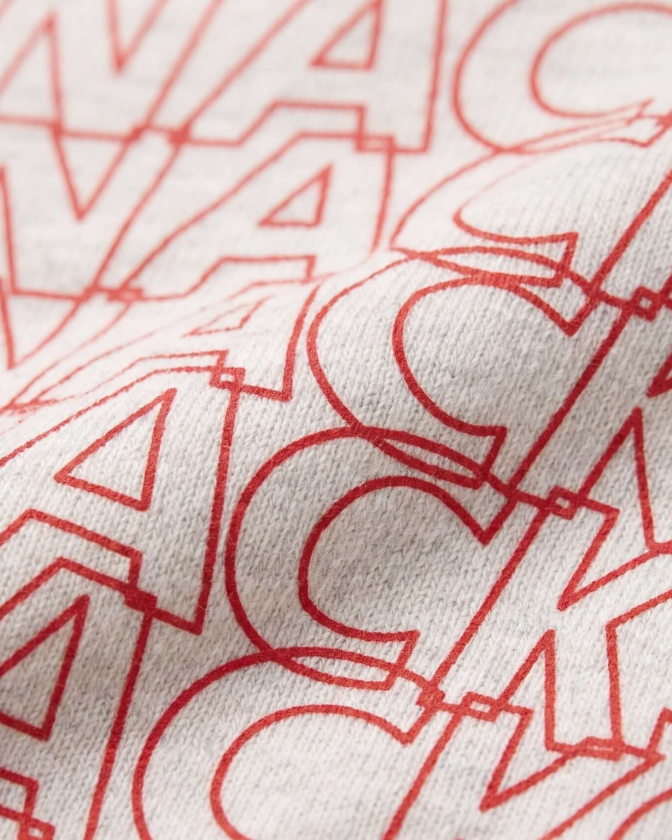 Close-up of red geometric pattern on a white background