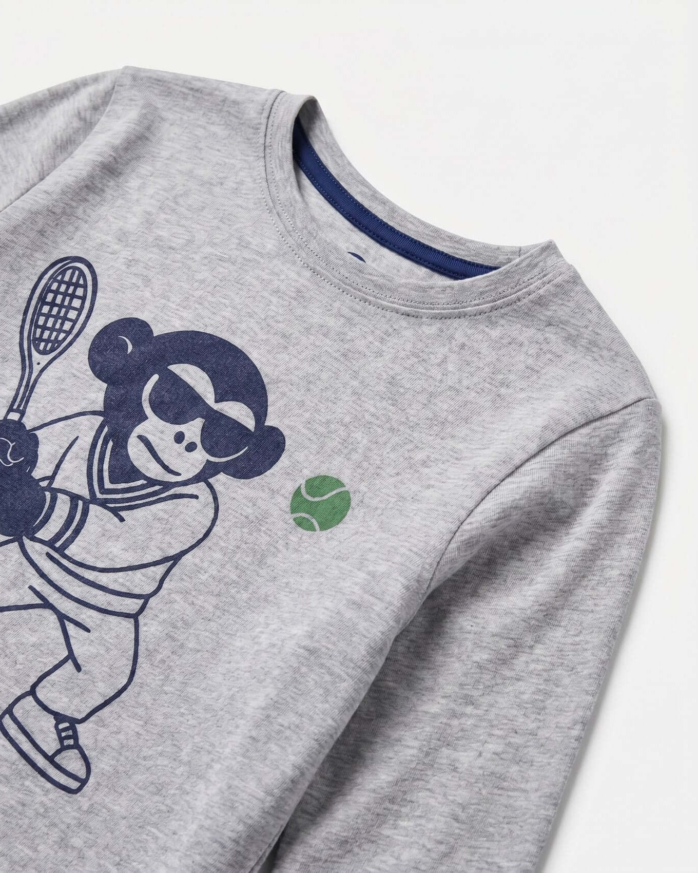 Gray sweatshirt with a graphic of a person playing tennis on a white background