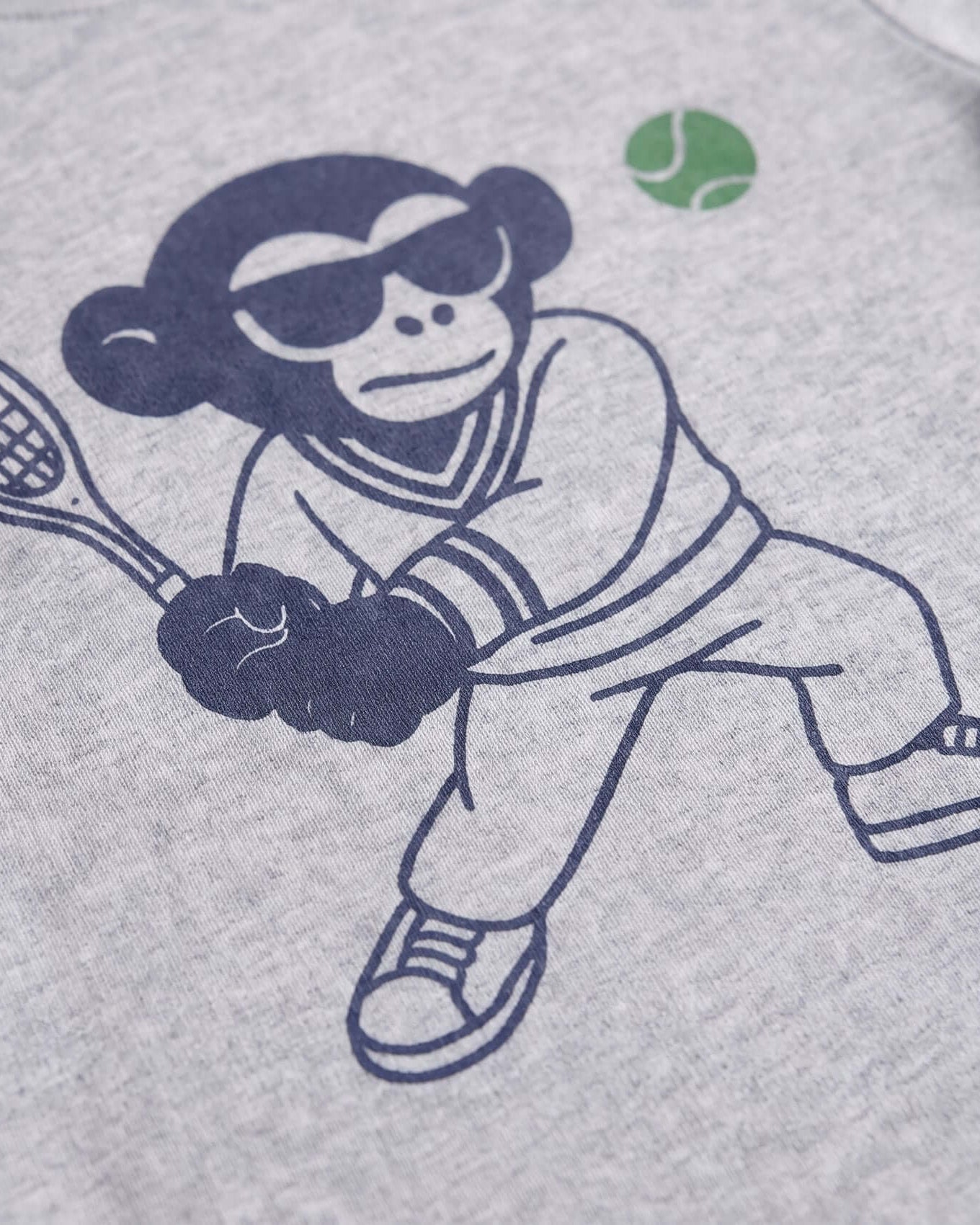 Illustration of a monkey playing tennis on a gray background