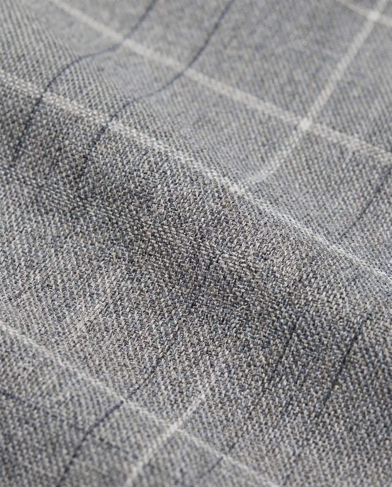 Close-up of gray fabric with a subtle check pattern