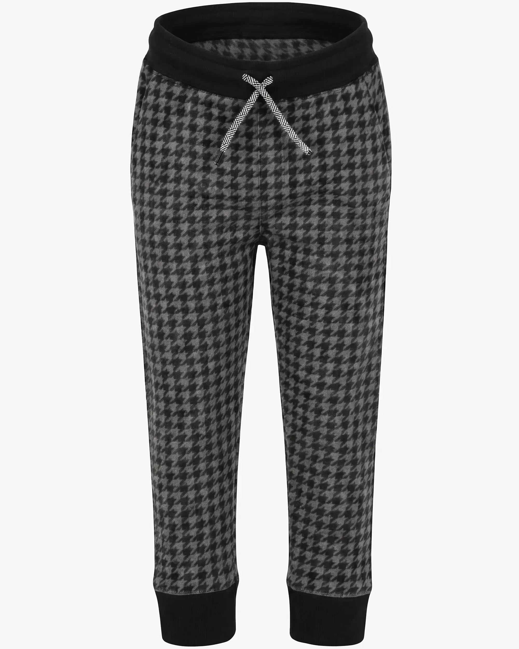 A pair of children's jogger-style pants featuring a black and gray houndstooth pattern, a solid black elastic waistband with a silver drawstring, and solid black ribbed ankle cuffs, shown against a plain light gray background.