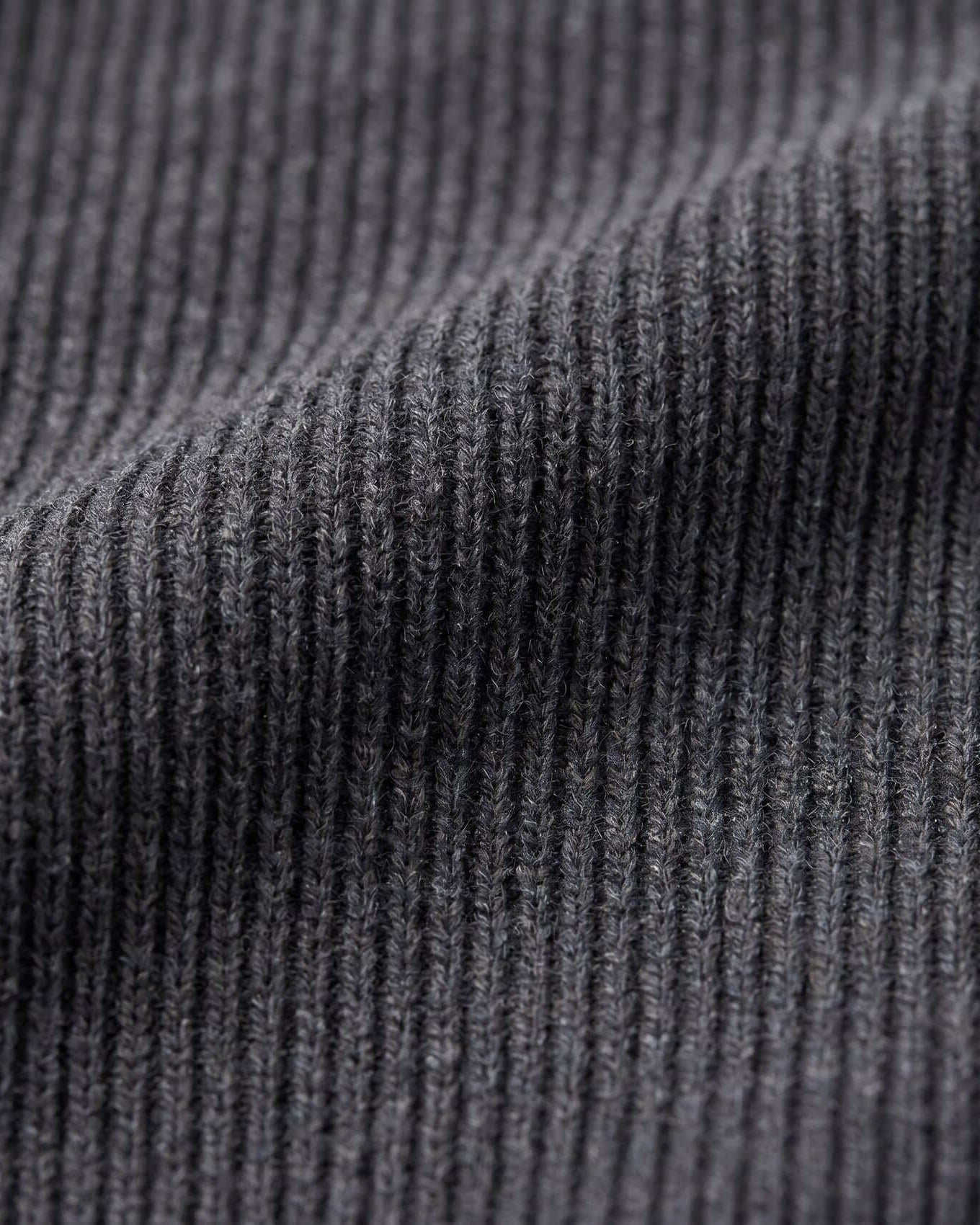 Close-up of dark gray ribbed fabric texture