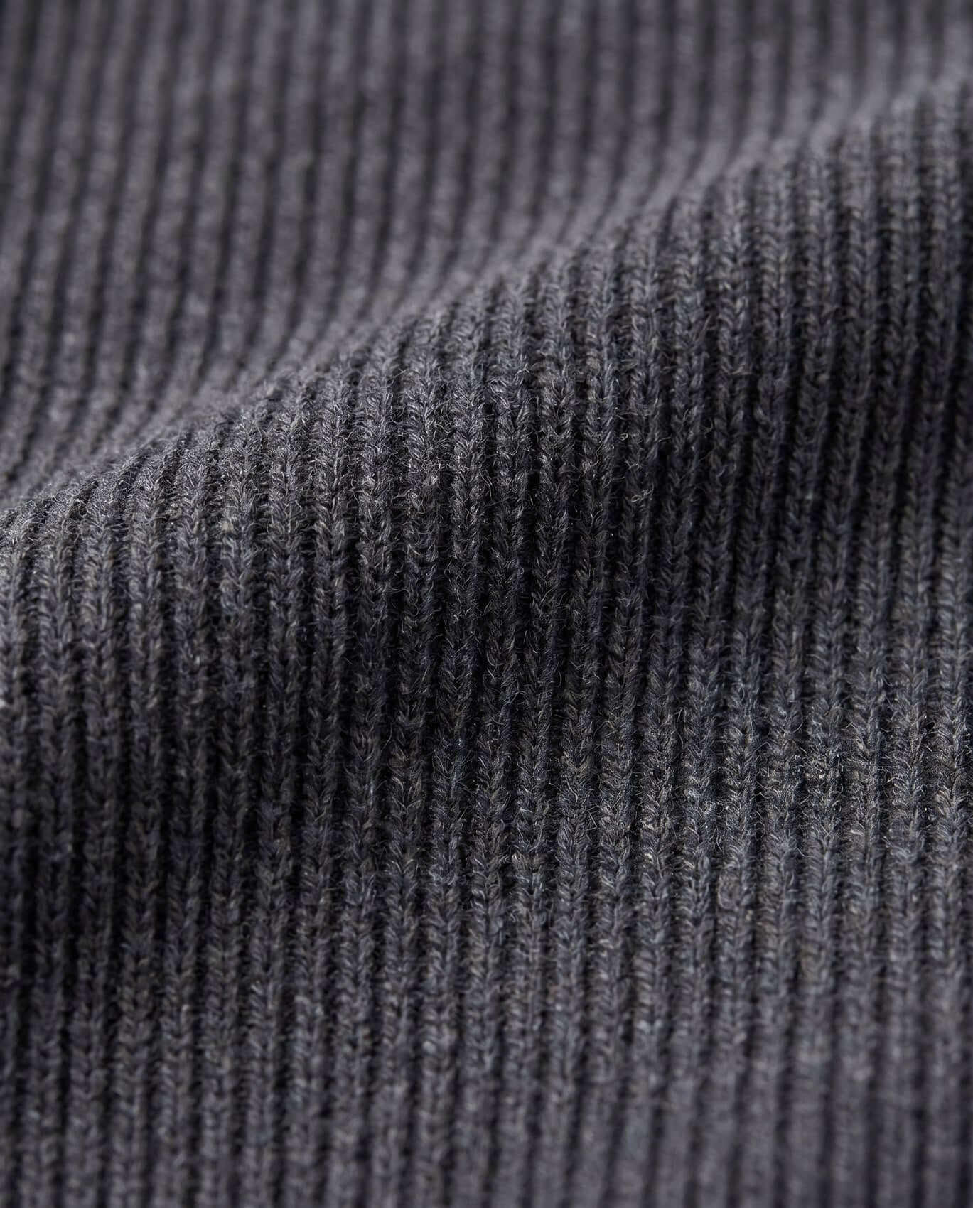 Close-up of dark gray ribbed fabric texture