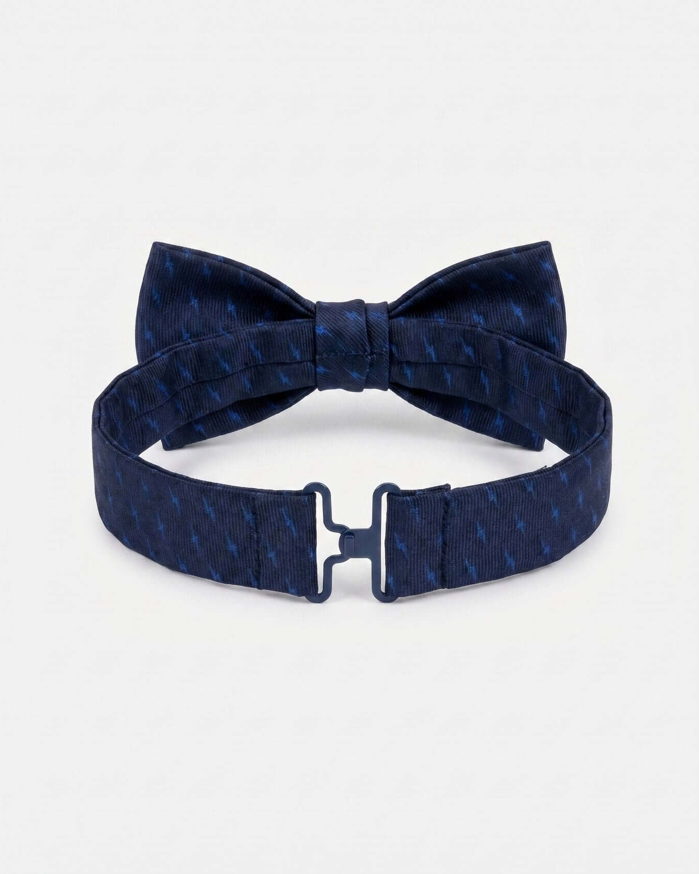 Navy blue bow tie with matching belt on a light gray background