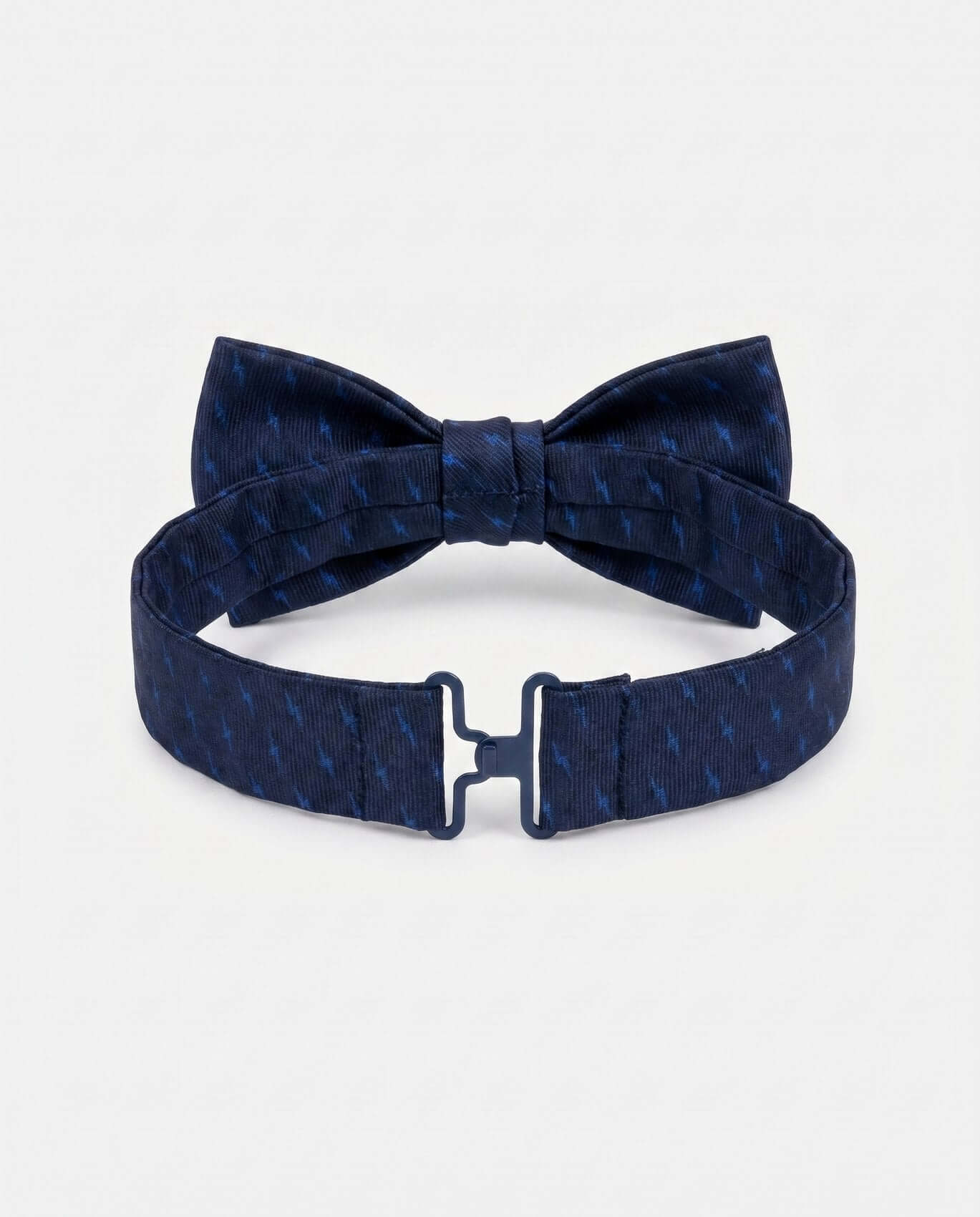 Navy blue bow tie with matching belt on a light gray background