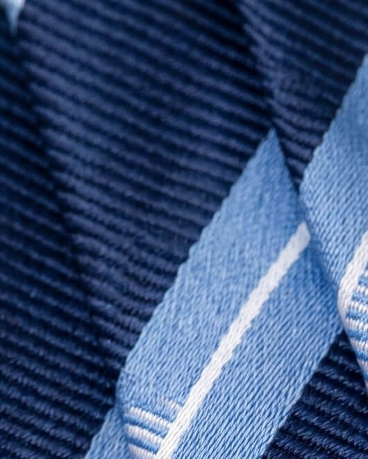 Close-up of a blue fabric with a textured pattern