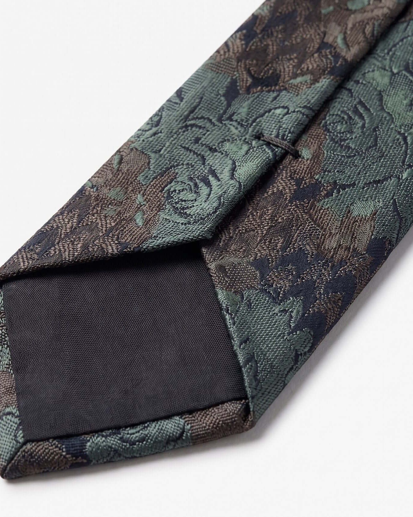 Floral patterned tie on a white background
