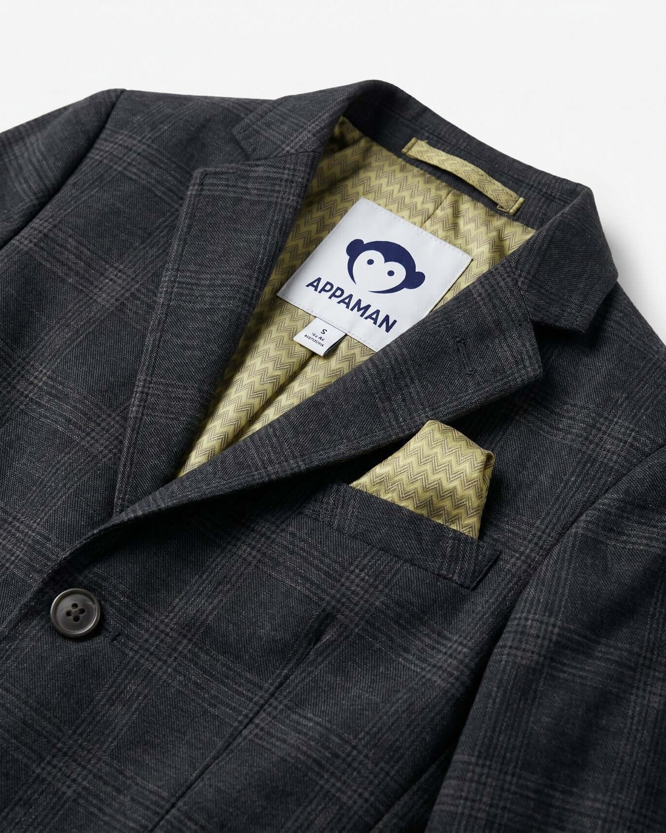 Gray checkered jacket with a brand label on a white background
