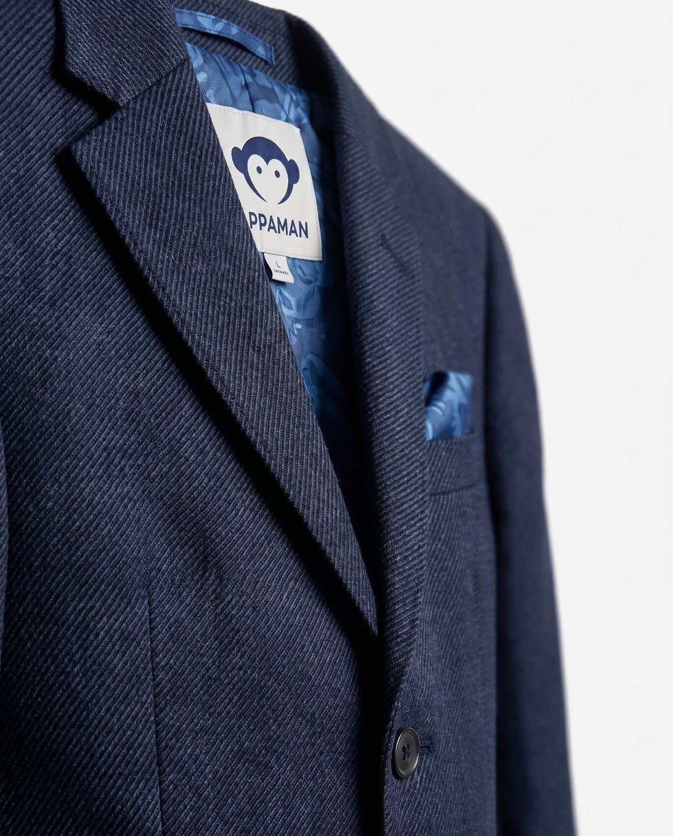 Close-up product detail focusing on the upper lapel and chest area. Clean white background.