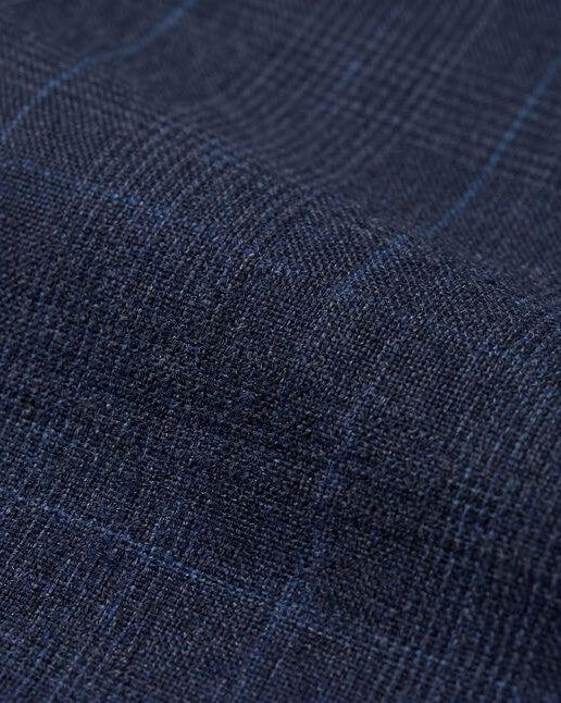 Close-up of blue fabric with a subtle pattern