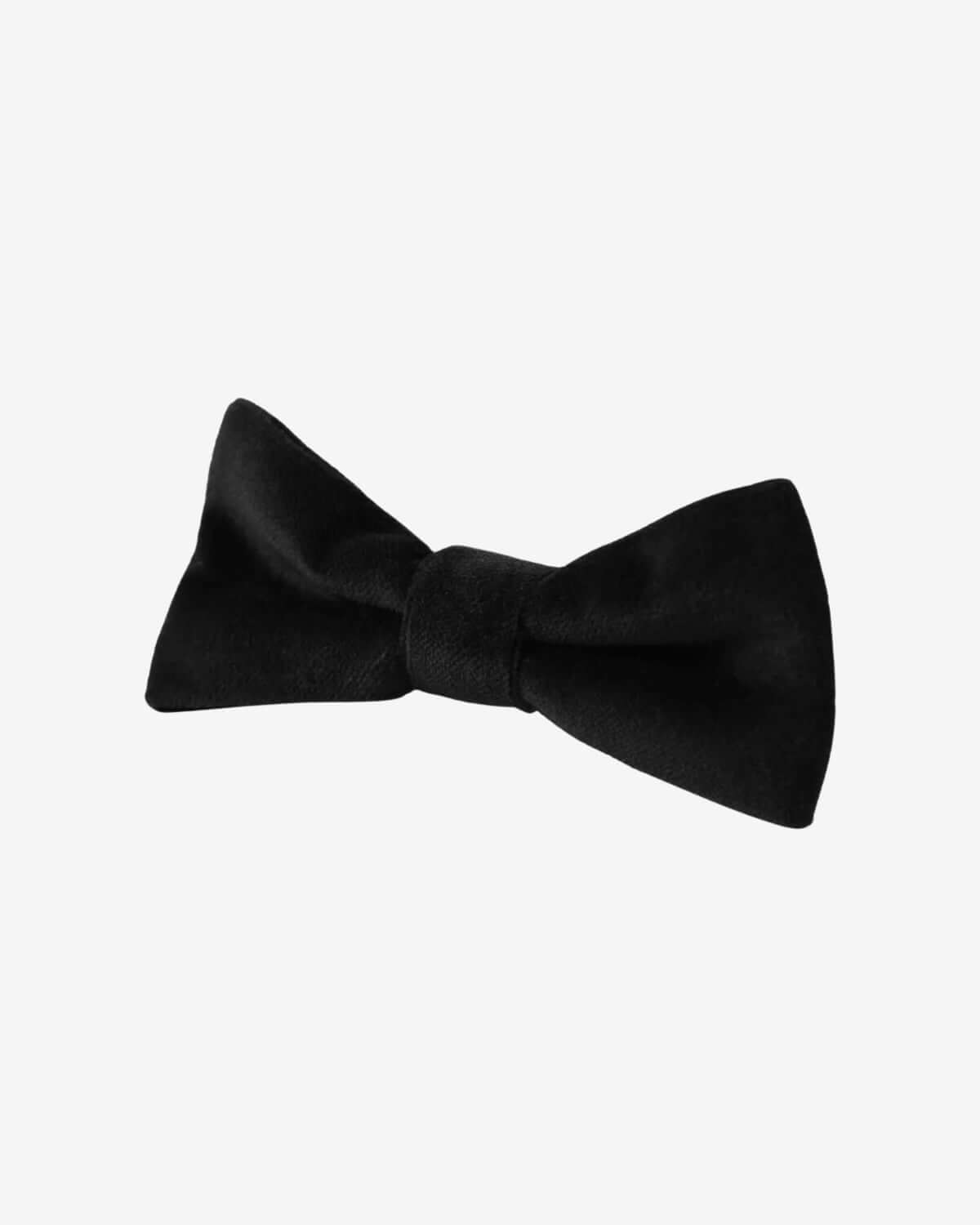 Black Velvet Bowtie made of 100% polyester, featuring a smooth and matte feel for boys' special occasions.