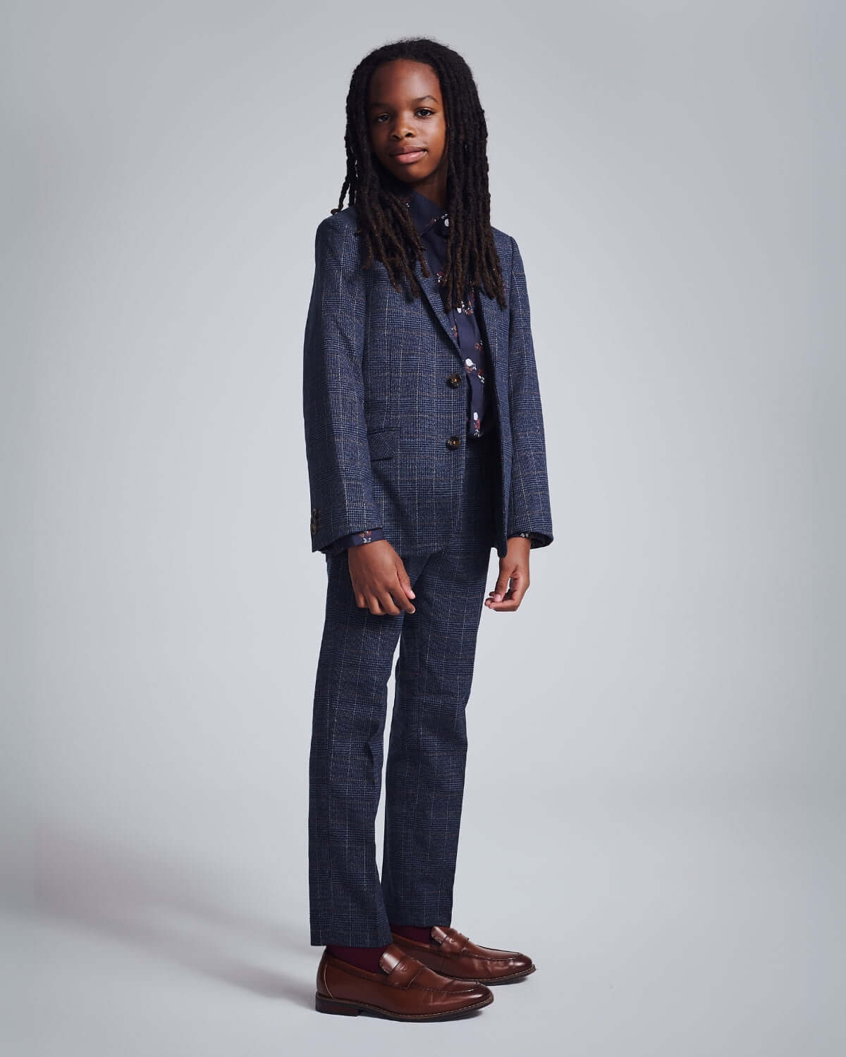Gotham Plaid Stretchy Mod Suit modeled by a child, showcasing modern style and comfortable fit.