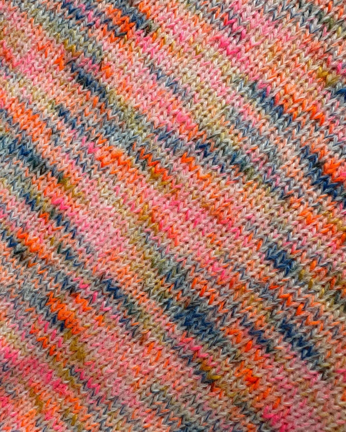 Vibrant space-dyed yarn showcasing playful pinks and blues—perfect for kids' stylish summer shorts!