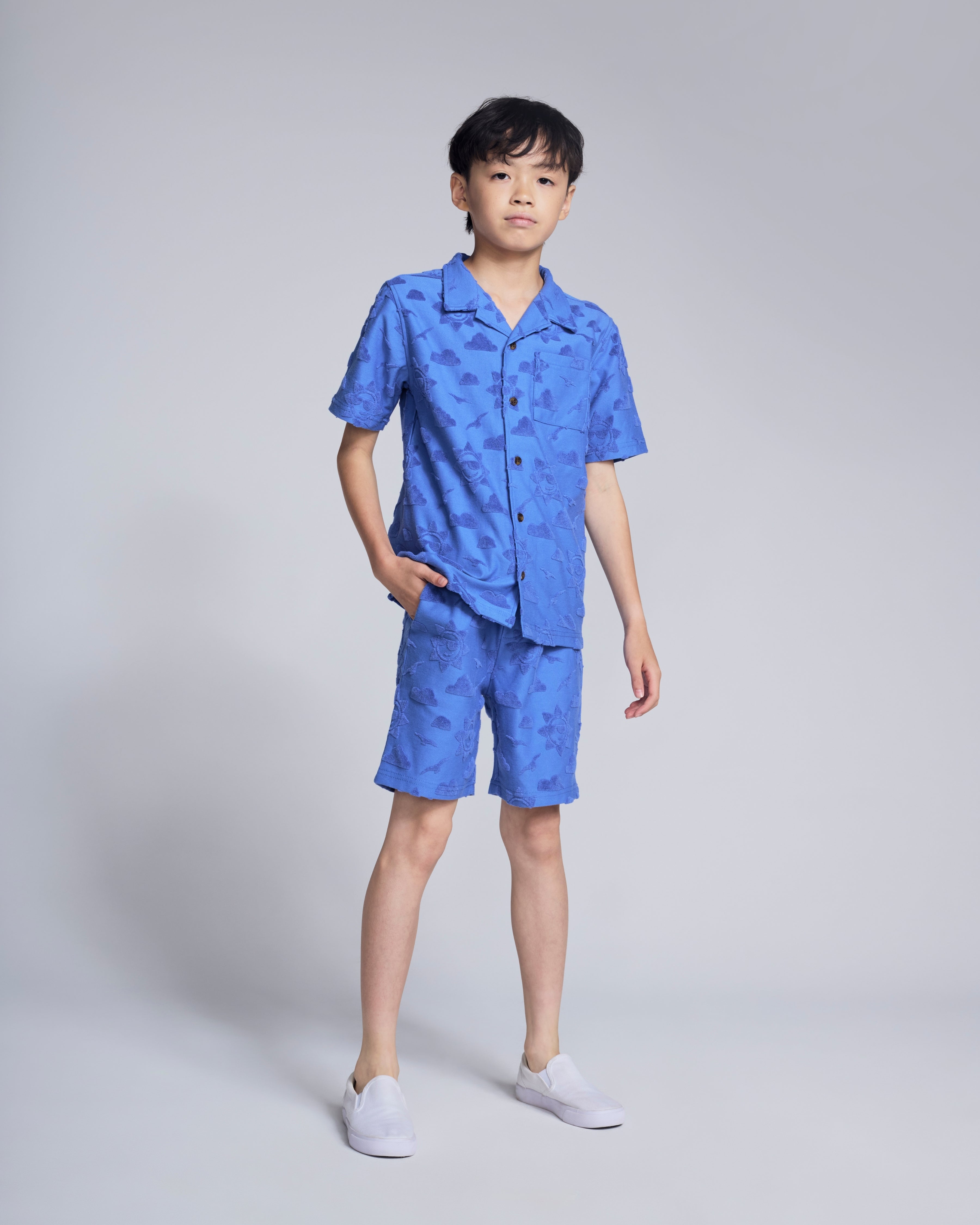 Cobalt Blue Terry Resort Shirt with textured sun and clouds pattern, perfect for summer vacations and warm-weather days.