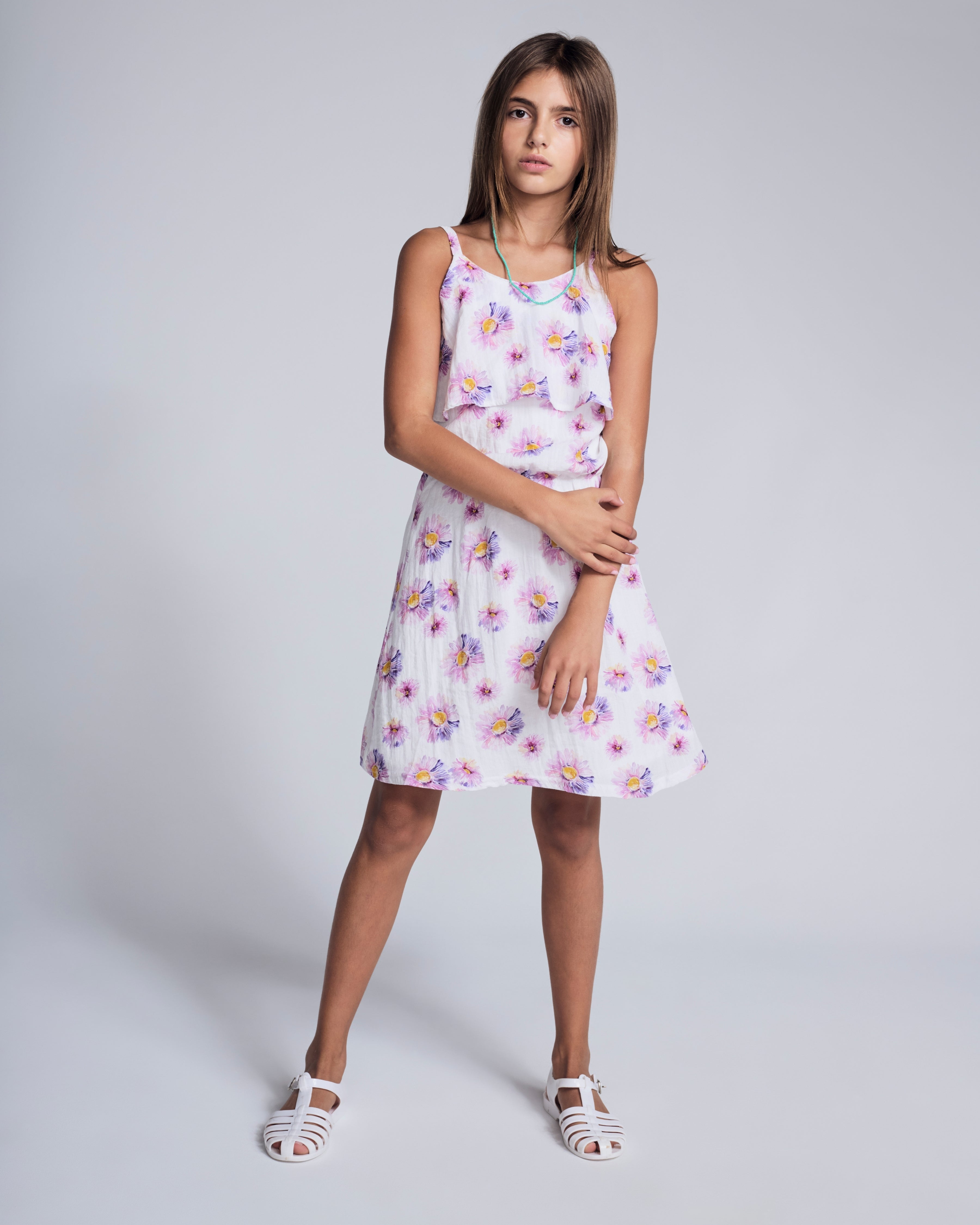 Daisies Leah Layered Dress on a girl with floral print and layered details, perfect for sunny days and parties.