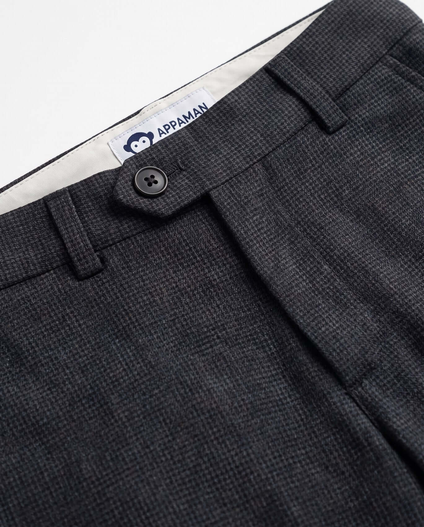 Close-up of dark gray pants with a visible Appaman label.