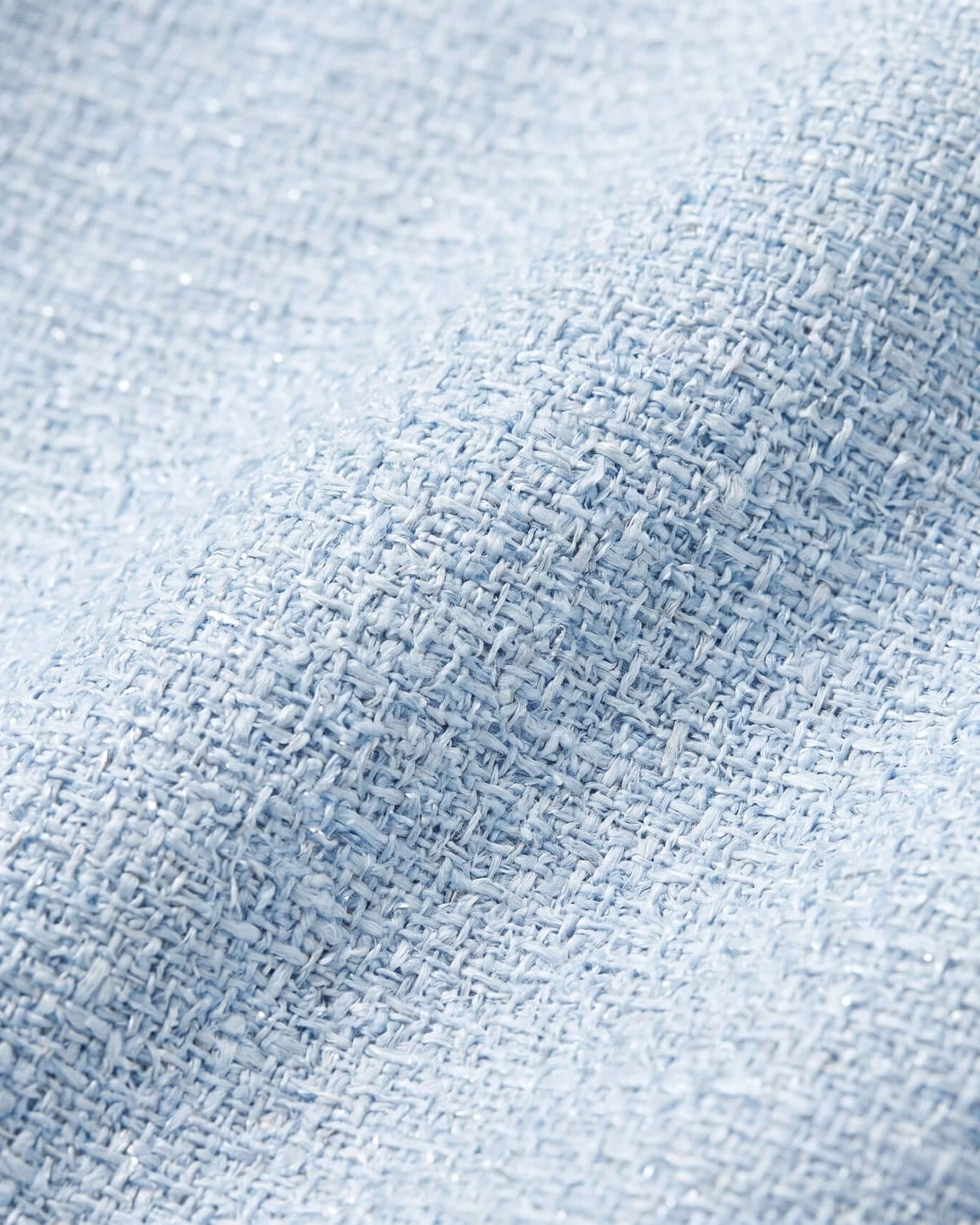 Close-up of textured light blue fabric