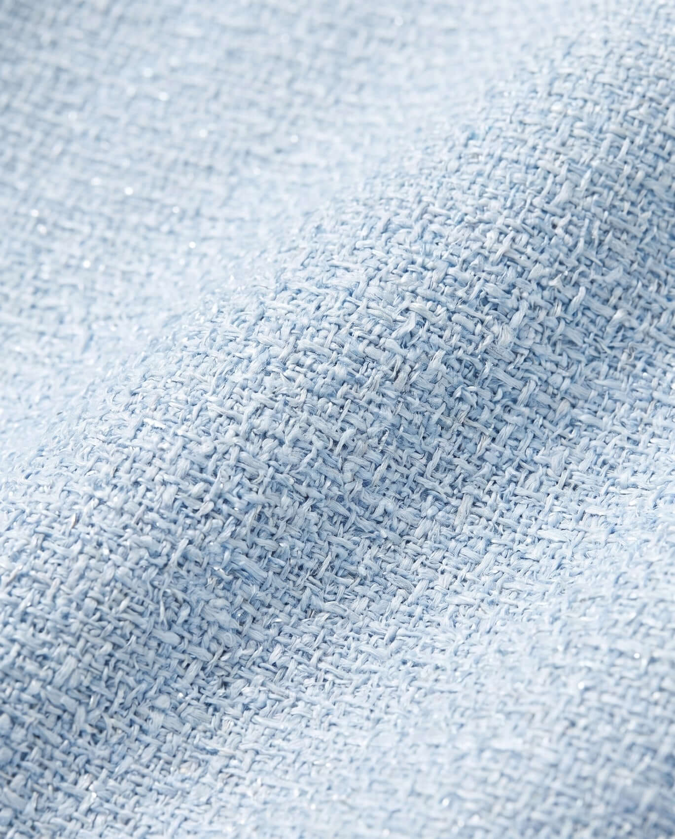 Close-up of textured light blue fabric