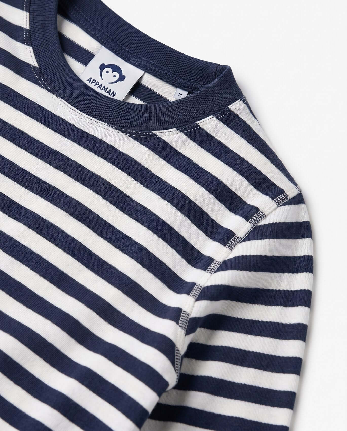 Navy and white striped shirt with Appaman label on a light gray background