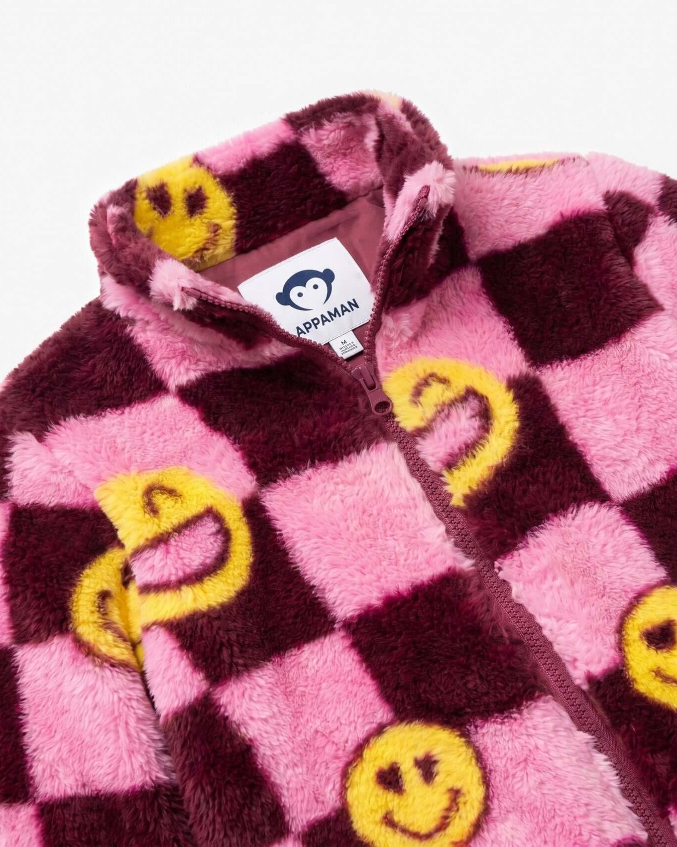 Pink and brown checkered jacket with yellow smiley face patterns, Appaman brand visible.