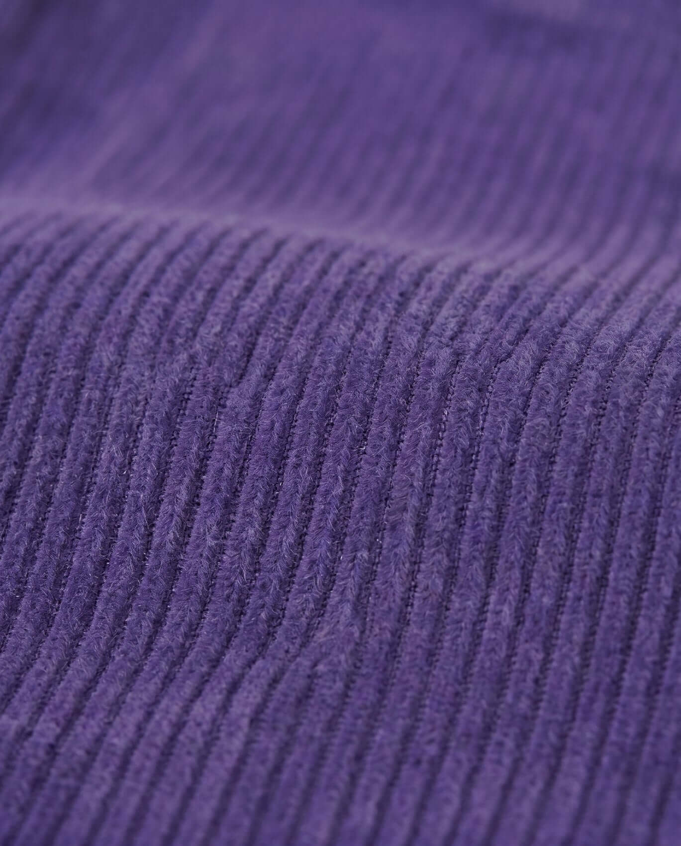 Close-up of purple ribbed fabric texture