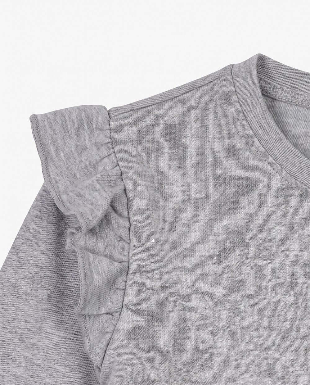 Gray ruffled sleeve on a plain background
