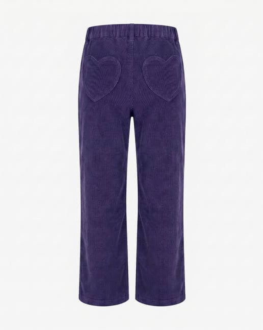 Purple corduroy pants with heart shapes on a white background